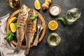 Grilled sea bass fish on a dark background. banner, menu, recipe place for text, top view Royalty Free Stock Photo