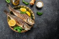 Grilled sea bass fish on a dark background. banner, menu, recipe place for text, top view Royalty Free Stock Photo
