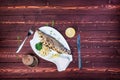 Grilled sea bass on a plate. Healthy food. Served Cauliflower and Broccoli. There is a black pepper and cutlery. Top Royalty Free Stock Photo