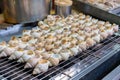 Grilled sea snails or fresh shells on the grill at Taipei street food Royalty Free Stock Photo