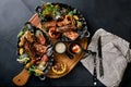 Grilled seafood platter. Assorted delicious grilled seafood with vegetables. Grilled mixed bastards with pepper sauce