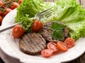 Grilled seitan with tomatoes Royalty Free Stock Photo