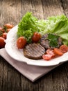 Grilled seitan with tomatoes Royalty Free Stock Photo