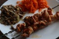 grilled shashlyk - kebab with carrot salat and mushrooms