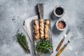 Grilled shish kebab with Chicken meat, poultry skewers with salad. Gray background. Top view Royalty Free Stock Photo