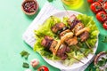 Grilled shish kebab or shashlik on green table.