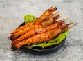 Grilled shrimp with salt and chili or tom nuong muoi ot with lettuce leaf served in dish isolated on grey background top view of