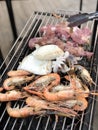 Grilled shrimp, squid, pork for dinner Royalty Free Stock Photo
