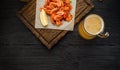 Grilled shrimps on a board and beer mug. Royalty Free Stock Photo