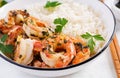 King prawn tails in orange-garlic sauce with parsley