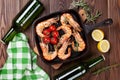 Grilled shrimps on frying pan and beer Royalty Free Stock Photo