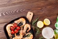 Grilled shrimps on frying pan and beer Royalty Free Stock Photo