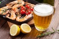 Grilled shrimps on frying pan and beer Royalty Free Stock Photo