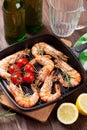 Grilled shrimps on frying pan and beer Royalty Free Stock Photo