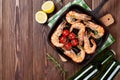 Grilled shrimps on frying pan and beer Royalty Free Stock Photo