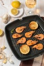 Grilled shrimps on a grill frying pan with wine Royalty Free Stock Photo