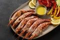 Grilled shrimps on plate with lemon slice and vegetables. Seafood background Royalty Free Stock Photo