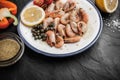 Grilled shrimps with sauce and vegetables on the ceramic plate Royalty Free Stock Photo