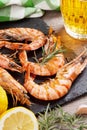 Grilled shrimps on stone plate and beer mug Royalty Free Stock Photo