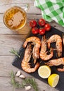 Grilled shrimps on stone plate and beer mug Royalty Free Stock Photo