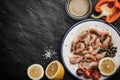 Grilled shrimps with vegetables and seasoning on the ceramic plate Royalty Free Stock Photo