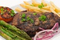 Grilled sirloin steak and fries dinner Royalty Free Stock Photo