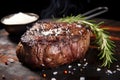 grilled sirloin steak garnished with rosemary and salt Royalty Free Stock Photo