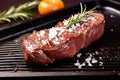 grilled sirloin steak garnished with rosemary and salt Royalty Free Stock Photo
