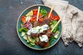 Grilled skewer meat beef kebabs on sticks served with fresh vegetables salad on plate on rustic concrete background from Royalty Free Stock Photo