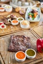 Grilled Skirt Steak. Barbecue restaurant menu. Many different food on the table. Dinner party or Banquet. Royalty Free Stock Photo