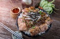 Grilled slice pork with charcoal flame set on rice bowl in Japan Royalty Free Stock Photo