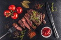 Grilled sliced beef steak at slate board