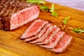 Grilled rare angus beef steak on wooden board Royalty Free Stock Photo