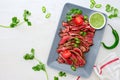 Grilled and sliced rare beef skirt steak served with green chimichurri sauce Royalty Free Stock Photo