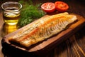 grilled smoked haddock fillet on a wooden board