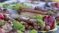 Grilled smoked sausages and meatballs outdoors. Meat baked on the grill bbq. Meat delicacies. Sausages homemade sausages on the Royalty Free Stock Photo