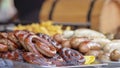 Grilled smoked sausages and meatballs outdoors. Meat baked on the grill bbq. Meat delicacies. Sausages homemade sausages on the Royalty Free Stock Photo