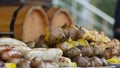 Grilled smoked sausages and meatballs outdoors. Meat baked on the grill bbq. Meat delicacies. Sausages homemade sausages on the Royalty Free Stock Photo