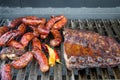 Grilled smoky sausages, peppers and paprika, street food, mobile BBQ Royalty Free Stock Photo