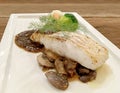 Grilled Snapper fish stake with mushroom Sauce and fresh green vegetable