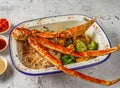 Grilled snow crab cluster with fried rice, grilled corn and broccoli served in isolated on grey background top view of singaporean Royalty Free Stock Photo