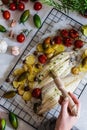 Grilled sole fish with green and red cherry tomatos, potatoe, capers, garlic, parsley and olive oil Royalty Free Stock Photo