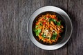 Grilled soy meat strips with egg noodle in a bowl