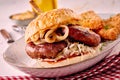 Grilled spicy bratwurst burger on a sesame bun Royalty Free Stock Photo