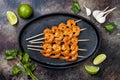 Grilled spicy lime shrimp skewers with creamy avocado garlic cilantro sauce. Top view, overhead, flat lay, copy space. Royalty Free Stock Photo