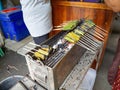 Grilled squid eggs,Wrapped in banana leaves,Taste is delicious,At market Bangkachao Bangkok Thailand Royalty Free Stock Photo