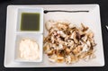 Grilled squid, grilled cuttlefish served as a Spanish tapa with garlic oil and Royalty Free Stock Photo