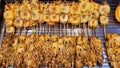 Grilled Squid Popular Street Food In Thailand BBQ Squid On A Stick Grilled Buttered Fresh Squid Many Of Grilled Squid In Thai Mark Royalty Free Stock Photo