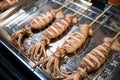 Grilled squids selling at the food stall at the night market. Royalty Free Stock Photo