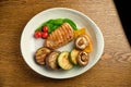 Grilled steak with champignons Royalty Free Stock Photo